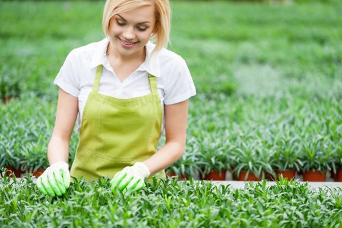 Customer pointing to booking form on a tablet for garden services